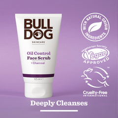 A tube of Oil Control Face Scrub for men with charcoal is shown, featuring natural origin ingredients, vegan approval, cruelty-free certification, and the phrase Deeply Cleanses on the packaging.