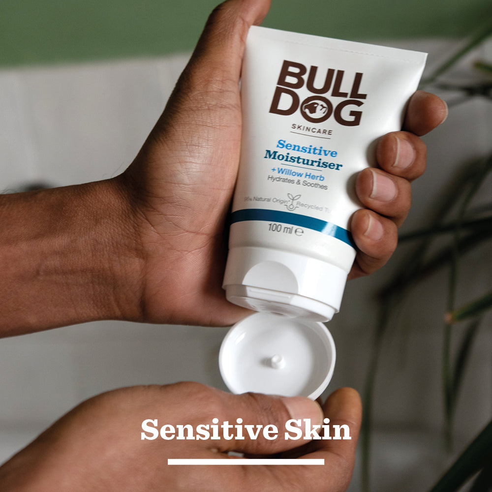 A person sprays Sensitive Spray Deodorant Bundle into their hand. The text Sensitive Skin appears at the bottom of the image.
