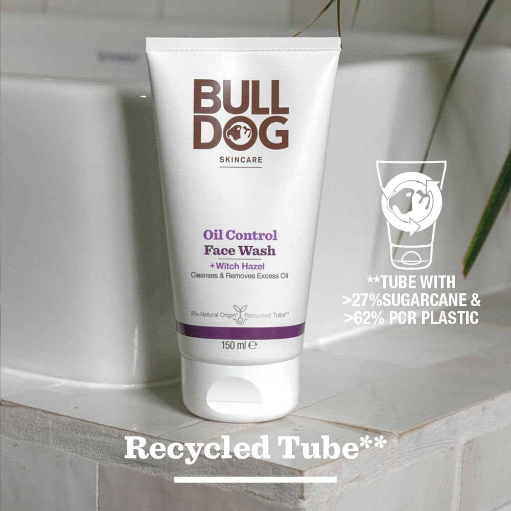 A tube of Oil Control Face Wash rests on a bathroom counter. Text notes its made with over 27% sugarcane, 62% recycled plastic, and natural origin ingredients. Recycled Tube appears at the bottom.