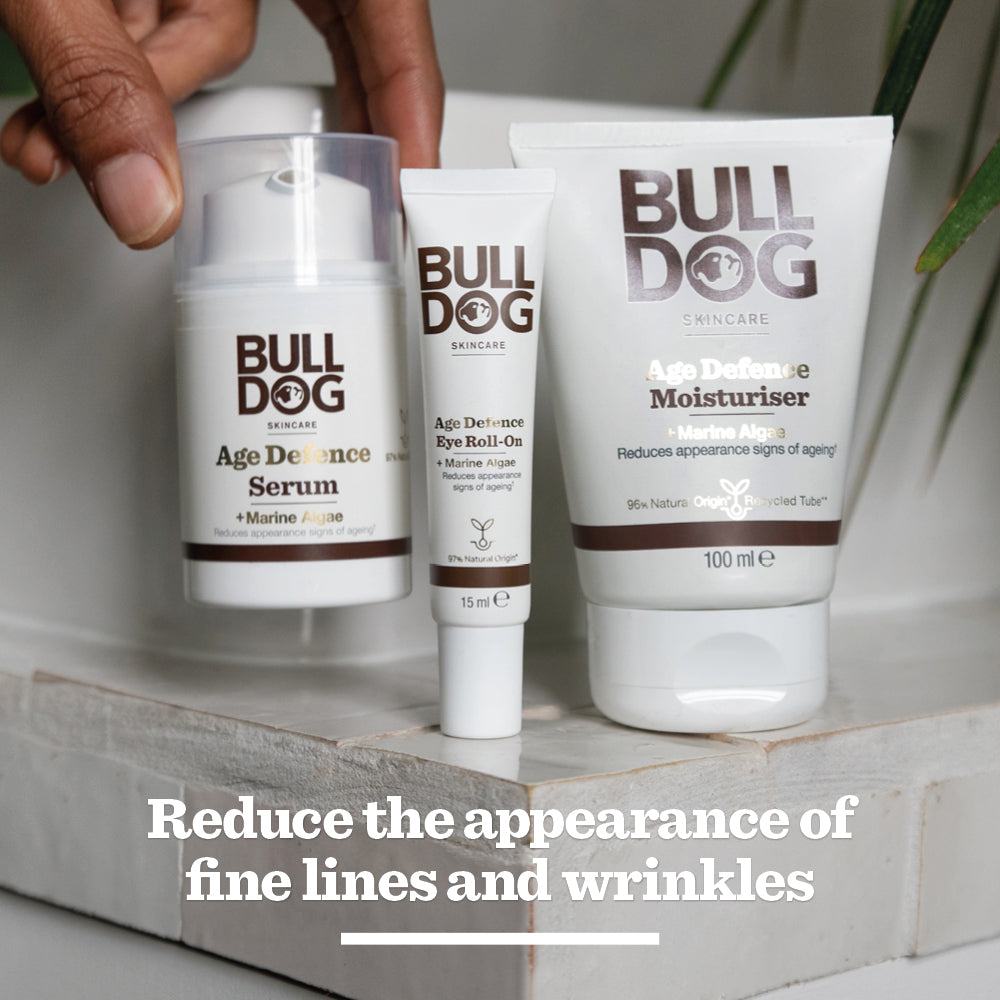 The Bulldog Skincare Age Defence Serum is displayed on a white surface. Text below reads: Reduce the appearance of fine lines and wrinkles with natural origin ingredients.