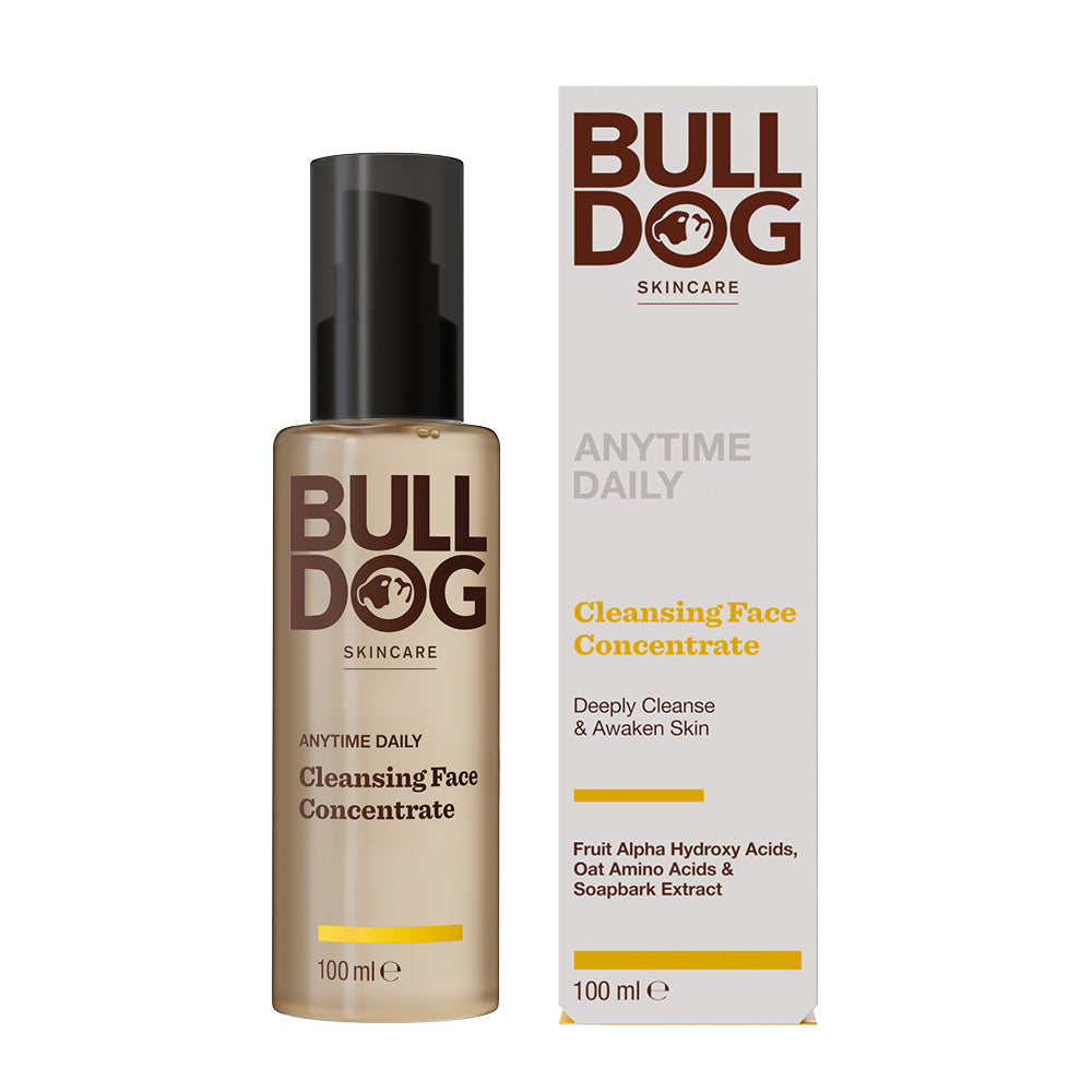 A 100ml bottle and box of Anytime Daily Cleansing Face Concentrate, in tan and white packaging with brown lettering, featuring natural origin ingredients like fruit alpha hydroxy acids, amino acids, and soapbark extract.