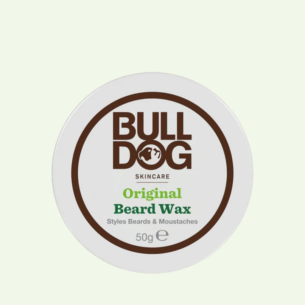 A round white container of Original Beard Wax, made with natural origin ingredients for moisturising and styling beards and moustaches. The 50g lid displays brown and green text.